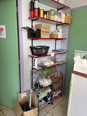 a room that has a shelf with many items on it