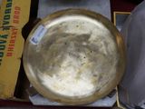 a metal bowl sitting on top of a box