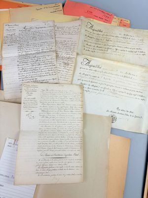 a lot of old papers on the table