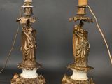 pair of antique bronze and marble candlesticks with figurines on marble bases