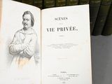 an open book with a drawing of a man standing in front of a row of books
