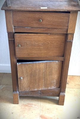 a small wooden table with a drawer on top of it