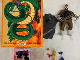 un dragon et un homme armé à côté d'une boîte de figurines