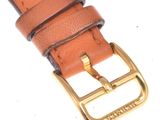 brown leather belt with gold buckle on a white background
