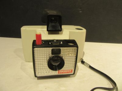 a polaroid camera sitting on top of a table