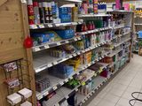 many shelves in the store that are full of cleaning products