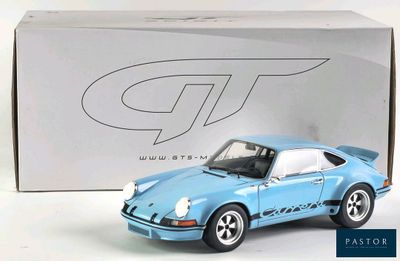 a toy car that is sitting in front of a box
