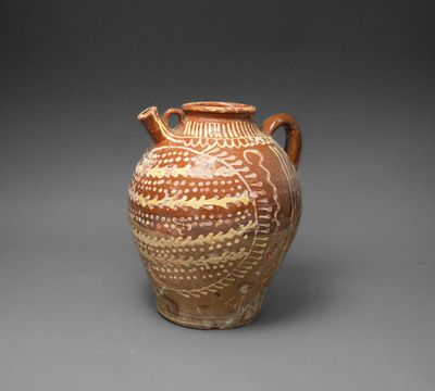 an image of a brown vase sitting on top of a table