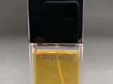 a bottle of chanel perfume sitting on top of a table