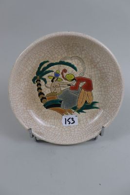 a small plate with a picture of a man and a dog on it