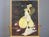 a painting on a easel with a painting of a woman