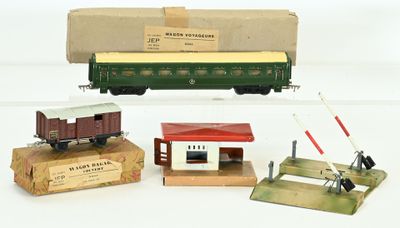 three toy train cars and a box with a train on it