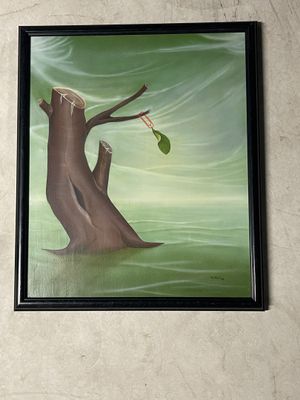 une photo d'un tableau représentant un arbre avec une feuille