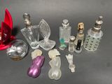 a lot of small glass bottles and a red object on the table