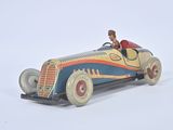 a small toy car with a man in the driver ' s seat