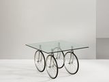 an image of a glass table with two wheels on it