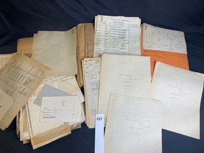 several old papers are stacked on top of each other