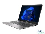 a laptop with a blue screen and keyboard on a white background