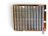 a box full of old books sitting on top of a table