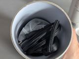 a person holding a cup with a lot of black stuff in it