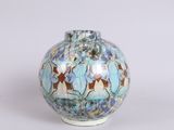 a small vase with a blue and brown design on it