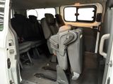 a white van that has a bunch of seats in it