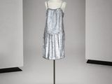an image of a dress on a mannequin stand in a room