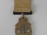 an image of a gold medal with a ribbon on a white background