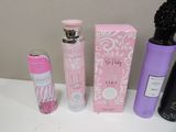 a bottle of perfume and a bottle of spray sitting on a table