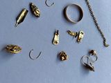 a lot of different types of jewelry on a blue surface