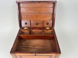a small wooden box with a drawer inside of it
