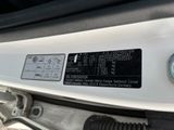 a close up of a car ' s engine with a bolt on it