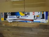 several skis are stacked on top of each other in a room