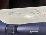 a close up of a pair of binoculars with a sticker on it