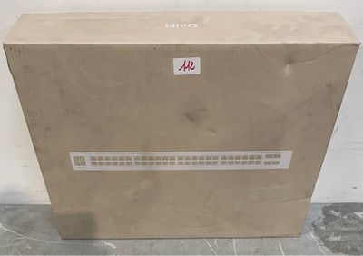 a box that is sitting on the floor with a sticker on it
