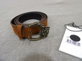 a brown belt with a brass buckle and a barcode on it