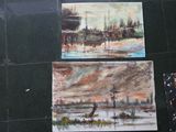 three paintings on the wall of a bathroom with a black tile floor