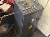 a machine that is sitting next to a red box