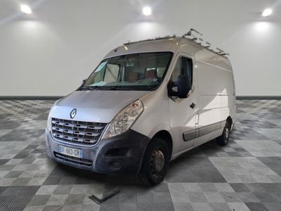 a white van parked in a room with checkered flooring