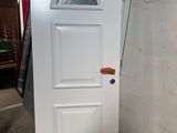 an image of a white door with an orange stripe on the side