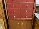 an image of a dresser with drawers and a painting on the wall