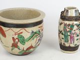 two vases sitting next to each other on a white surface