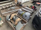 many different types of machinery on a pallet in a warehouse