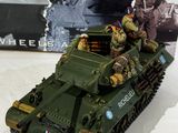 a model of a military vehicle with soldiers on top of it