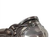 a silver spoon sitting on top of a table