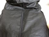 a black bag with a zipper on it sitting on a table