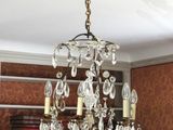 a chandelier hanging from the ceiling in a room