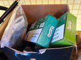 a box full of assorted items sitting on a counter