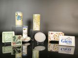 many different types of soaps and soap bars on a table
