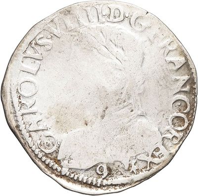 a close up of a coin on a white background